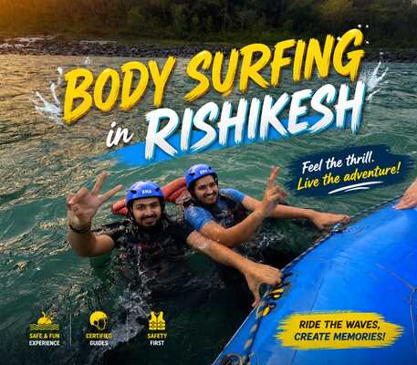 Two visitors are smiling and enjoying body surfing in Rishikesh