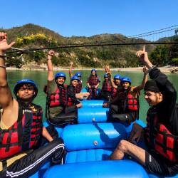 People enjoying rafting and capturing beautiful moments with a GoPro in Rishikesh