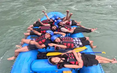 visitor relaxing on raftt during the marine drive to shivpuri rafting