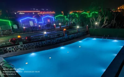 AC camp in Rishikesh with swimming pool and evening lights