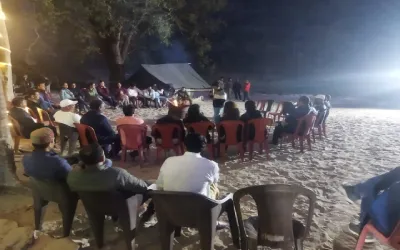 Beach camping in Rishikesh with evening gathering on the beach