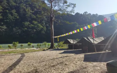 Camping in Rishikesh near Ganga with tents and forest views
